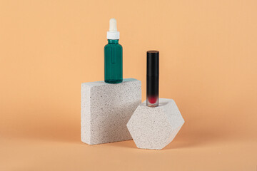 Mockup of black blank thin tube - mascara, lip gloss, gel, eyeliner, oil, etc. Cosmetic package with stylish props on cream background.