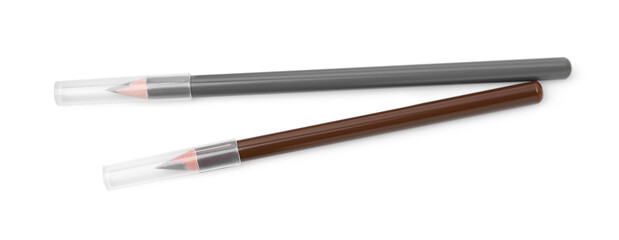 Different eyebrow pencils isolated on white, top view
