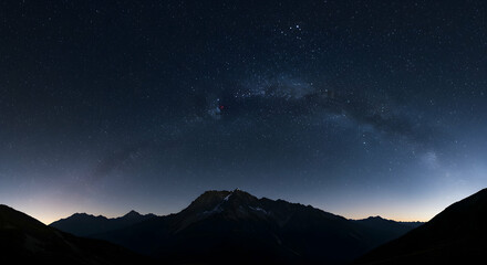 Night Sky with Stars Over Mountains Silhouette