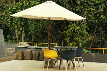 Umbrella, chairs and table at luxury resort