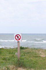 No Trespassing Sign at Coastal Grassland by the Baltic Sea in Staldzene. No Passing in Dunes, Walking Prohibited. Vertical