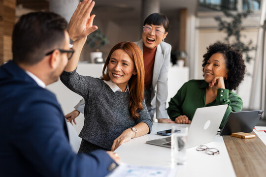 Team Celebrating Success with a High Five