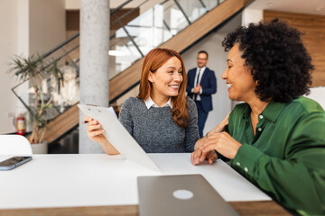 Professional Colleagues Engaged in a Discussion in a Modern Office Setting