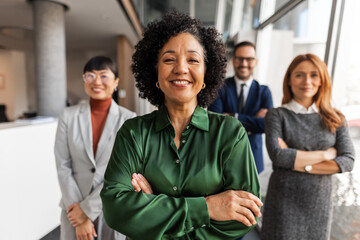 Team of Professionals Smiling in a Modern Office Environment