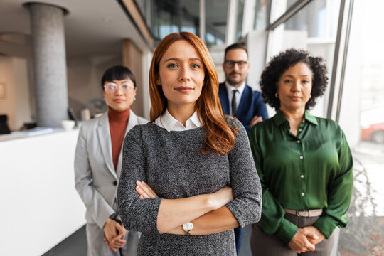 Confident Business Team Posing in Modern Office Environment