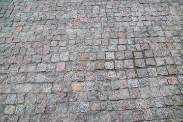 Rectangular natural stone sidewalk, texture backgrounds for graphic design. The wallpaper is abstract.