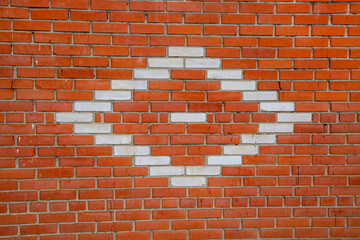 A red brick wall with a white diamond pattern, texture backgrounds for graphic design. The wallpaper is abstract.