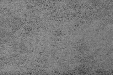 Structure of gray suede fabric with abstract shabby texture with embossed shades closeup, macro. Upholstery, decorative cloth structure, canvas for home decor. Background, backdrop, wallpaper.