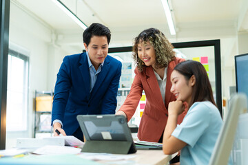 Group of young people working together.Creative business people discussion with coworker shareholder,discussing roadmap to product launch in office.planning,strategy,new business development concept