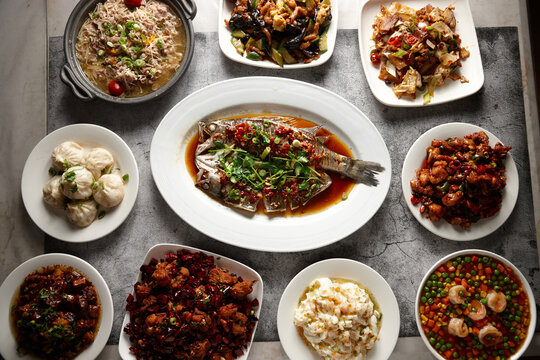 Top shot of different food dishes on a flat surface.
