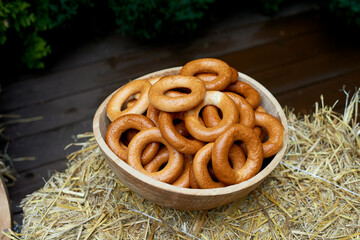 Wedding decoration in the Slavic style. Large sushki and bagels in a large wooden dish. Russian...