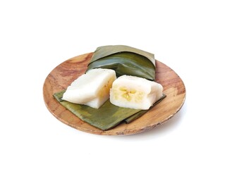 Papais or Nagasari cake on wooden plate. Indonesian food made from raw rice and glutinous rice wrapped in banana leaves. isolated on white background 