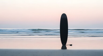 Surfboard Standing on Calm Beach at Sunset