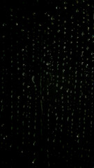 Dark Abstract Background with Raindrops on Window Glass at Night
