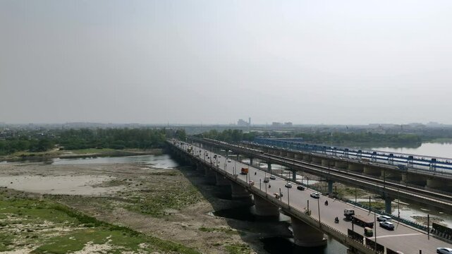 An Aerial Shot of Delhi Metro at Kalindi Kunj Bridge in Delhi, NCR, India
