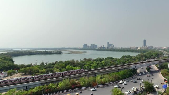 An Aerial Shot of Delhi Metro at Kalindi Kunj Bridge in Delhi, NCR, India
