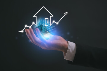 Hand holding chart in real estate investment energy efficiency rating and property value, Real...