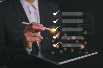 Businessman present virtual screen using pen tick correct marks in concept of practices and policies , procedure company articles of association Terms and Conditions compliance rule, law regulation