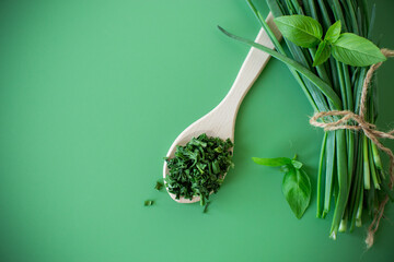 Top view of dried herbs and fresh green onions