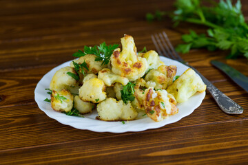 Rustic vegetable dish with cabbage and herbs, top view