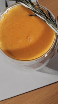 citrus cocktail with vitamins with a sprig