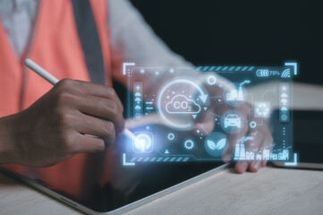 Engineer hand using computer and pen with virtual modern reduce co2 emission concept with icons global warming emissions carbon footprint climate change to limit global warming energy