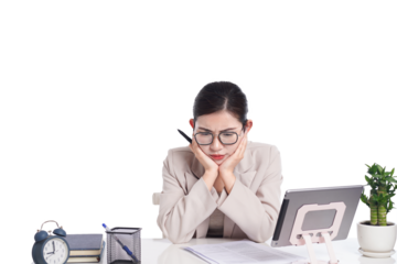 Asian businesswoman posing next to desk full of documents