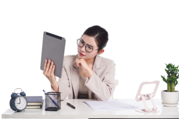 Asian businesswoman posing next to desk full of documents