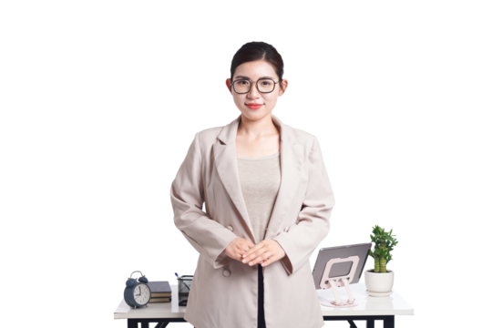 Asian businesswoman posing next to desk full of documents