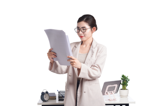 Asian businesswoman posing next to desk full of documents