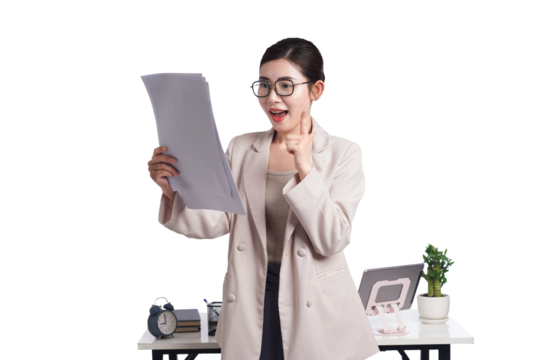 Asian businesswoman posing next to desk full of documents