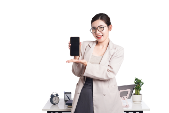 Asian businesswoman posing with smartphone, behind her is a table with lots of documents