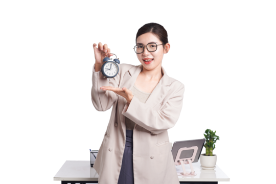 Asian businesswoman sAsian businesswoman smiling and presenting alarm clock, promoting time awareness in workplace
