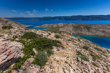 Fototapeta premium Panorama of the bay with the Vela Luka beach below, view of the beach from the top of the mountain, rocky beach
