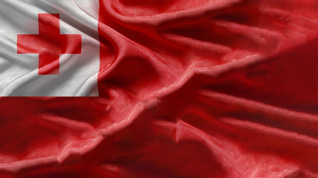 The flag of Tonga, made of silk, features bold red and white colors with a prominent cross, showcasing national pride in a smooth wave.