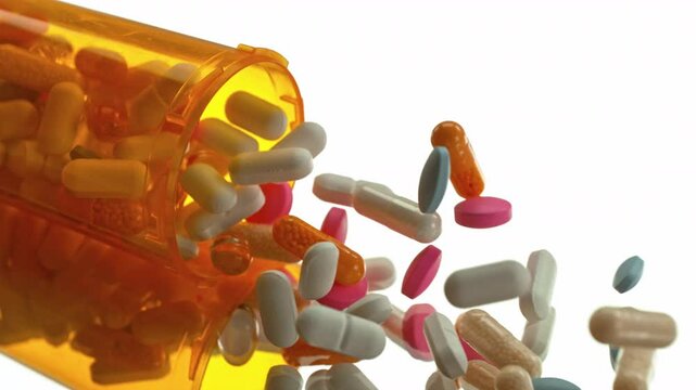 Super Slow Motion of Falling Medicine Dose with Various Pills at 1000fps. Pharmacy concept.