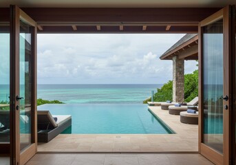 Ocean view from luxury villa with infinity pool and lounge chairs through open doors