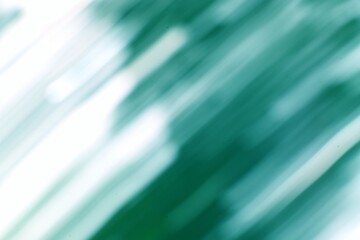 An abstract teal and white composition with blurred diagonal bands