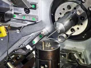 Wire bending machine demonstrates precision in metal fabrication at a manufacturing facility