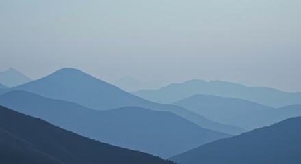 Misty blue mountains recede into the distance