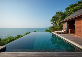 Fototapeta premium Infinity pool with ocean view at luxury tropical resort, thailand