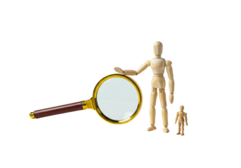Isolated Wooden Mannequin and Magnifying Glass