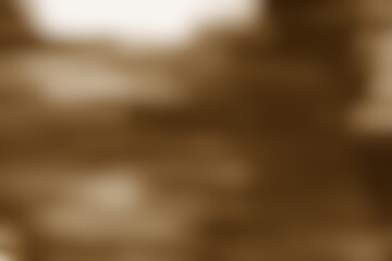 Blurred sepia abstract background featuring diffused light elements