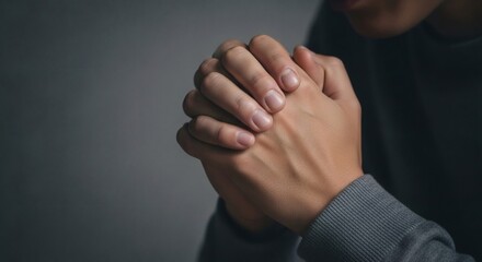 Hands clasped in prayer seeking hope faith and spirituality