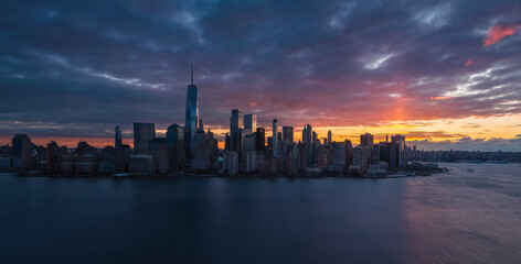 Fototapeta premium New York City aerial view of Lower Manhattan skyline at sunrise with World Trade Center and Financial District skyscrapers