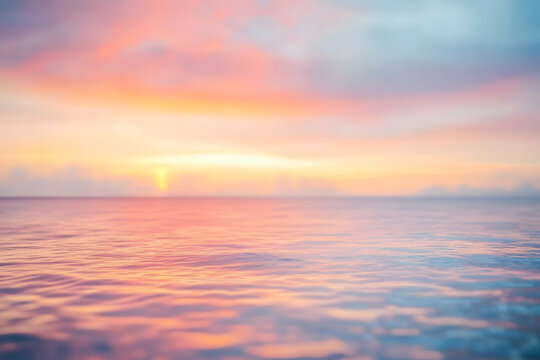 Blurred defocused sunset sky and ocean nature background.