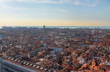 Naklejka premium Venice, Italy - Cityscape with red roofs and the Venetian Lagoon in the background