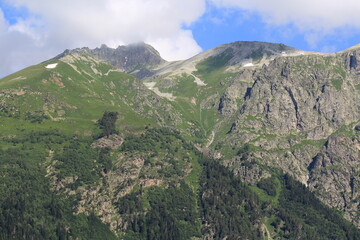 mountain peaks of the North Caucasus in Dombay on a sunny summer day