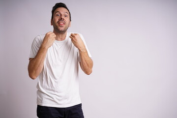 Fototapeta premium Male Model Showing Different Emotions on White Studio Background