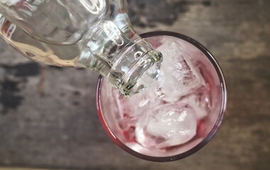 Red soda soft drink with ice